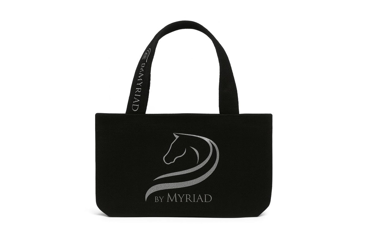 Black canvas tote bag with the by Myriad logo in reflective silver