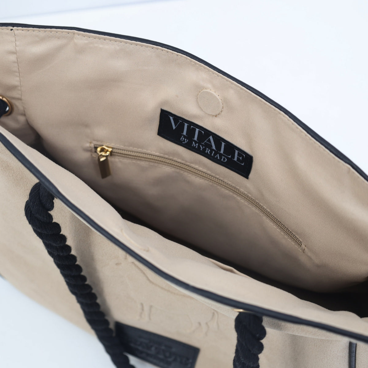 Inside of the Bray tote showing the Vitale by Myriad label and a zip pocket