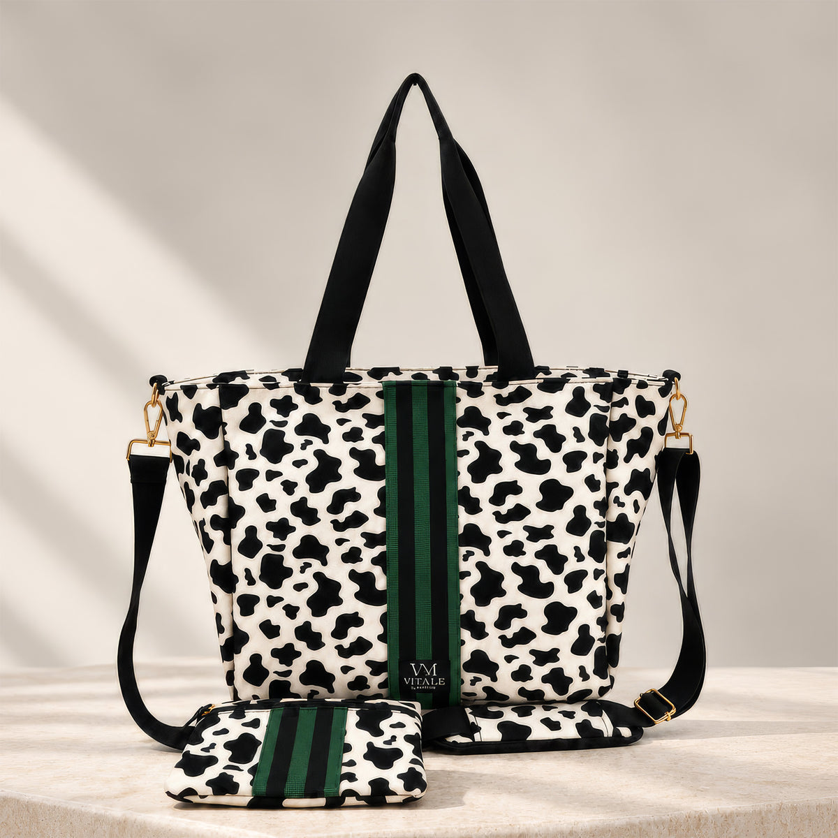 Dublin cow print tote with its detachable padded crossbody strap and matching zippered essentials pouch