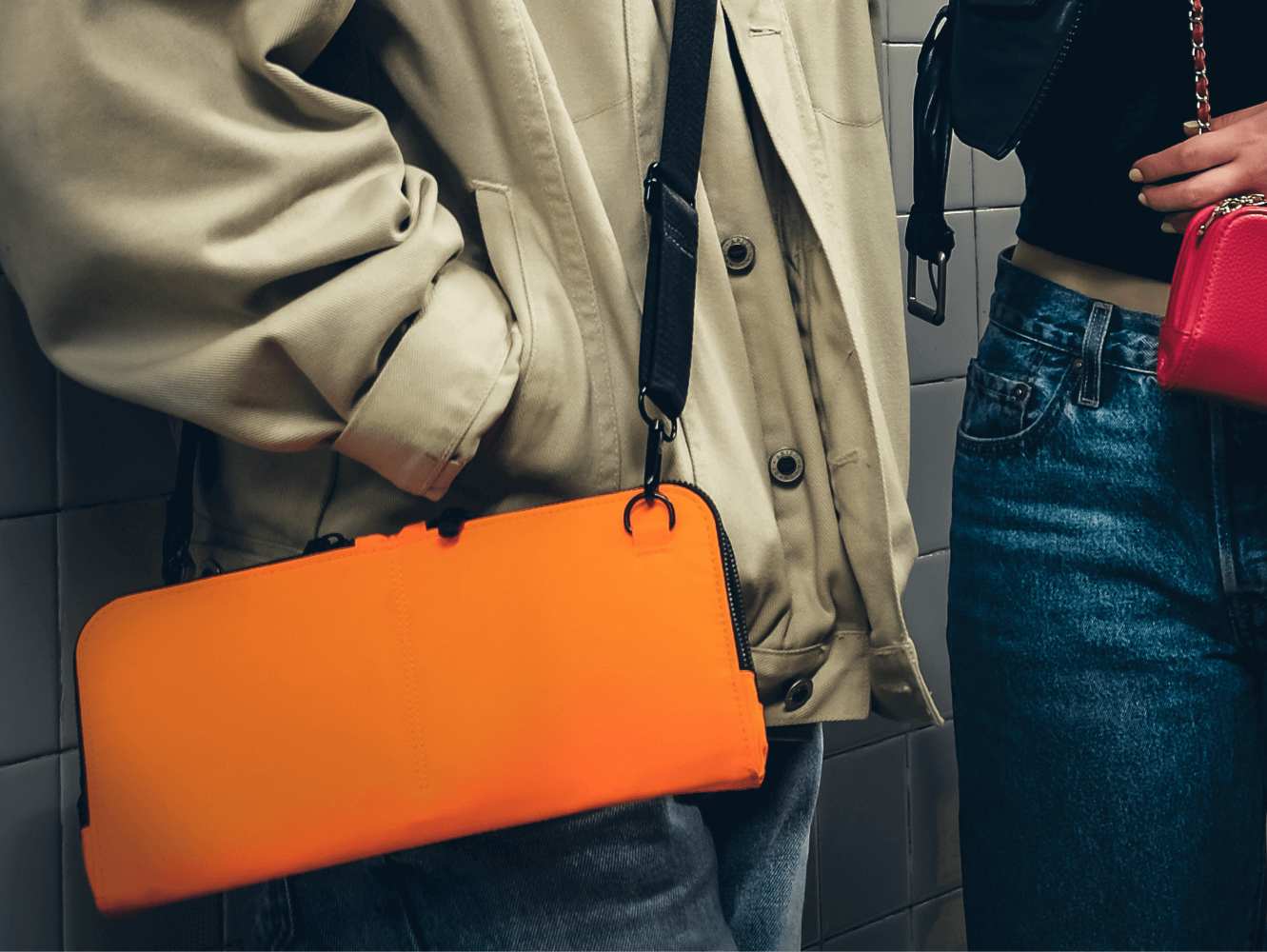 Vitale by Myriad orange crossbody lifestyle shot - premium nylon handbag with organized compartments