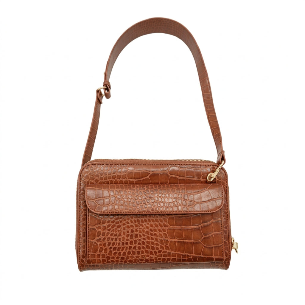 Vallina cognac croc-embossed crossbody with the crossbody strap held up, side view