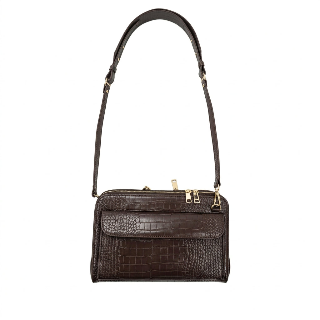 Vallina croc-embossed crossbody in mocha with its adjustable strap extended, on a white background