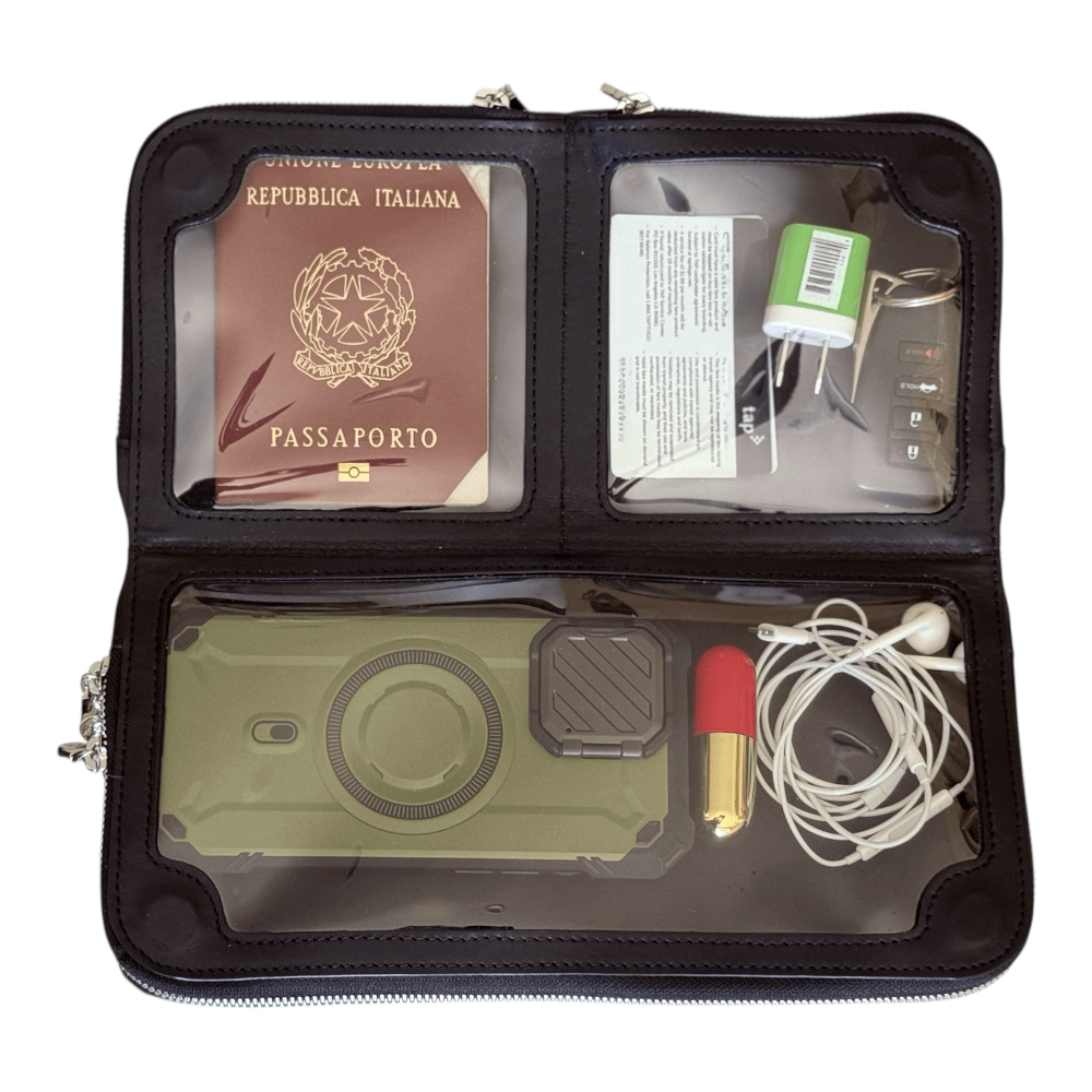 Zeloso Black Halo leather clutch open flat with a passport, phone and essentials in its compartments